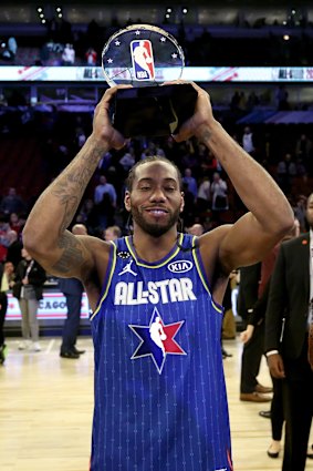 Kawhi Leonard with the Kobe Bryant MVP award after the 69th NBA All-Star Game.