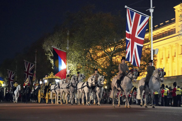 The countdown is on as the Diamond Jubilee State Coach is led in a procession near Buckingham Palace during rehearsals for Saturday’s coronation.