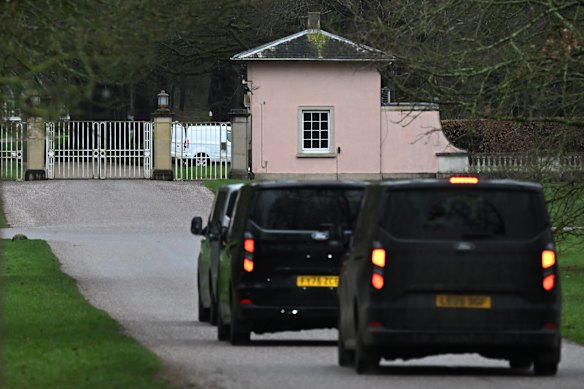 Unmarked police vehicles are seen arriving at Andrew’s former home, Royal Lodge, in Windsor.