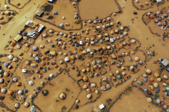 Huts made of branches and cloth provide little shelter from the heat in on the outskirts of Dollow, Somalia.