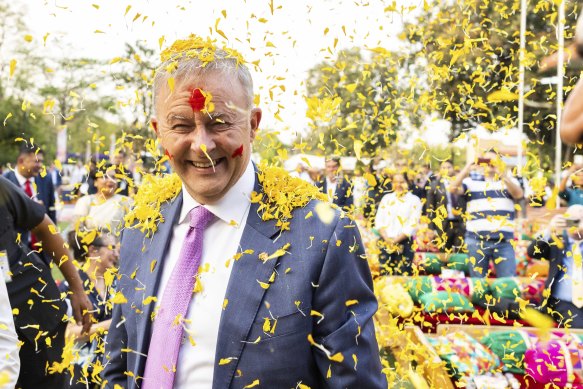 Albanese was greeted on Wednesday night with a shower of flower petals at a Holi celebration. 