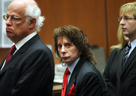 Phil Spector flanked by his lawyers Doran Weinberg (L) and Tran Smith looks at the jury as it they arrive before the verdict was read at Los Angeles Criminal Courts April 13, 2009 in Los Angeles, California.