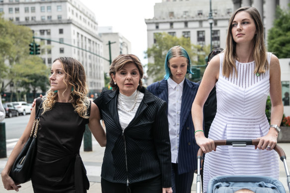 Gloria Allred, representing several of Jeffrey Epstein's alleged victims, second left, arrives at court.
