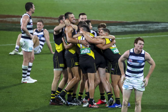 To the victors go the spoils: Richmond celebrate victory in the 2020 grand final over the Cats.