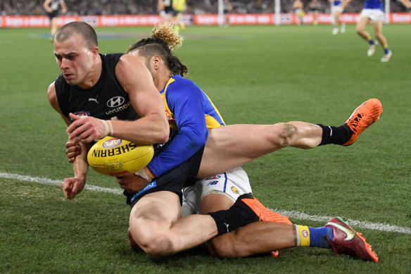 West Coast’s Sam Petrevski-Seton tackles Alex Cincotta of the Blues at Marvel Stadium on Saturday.