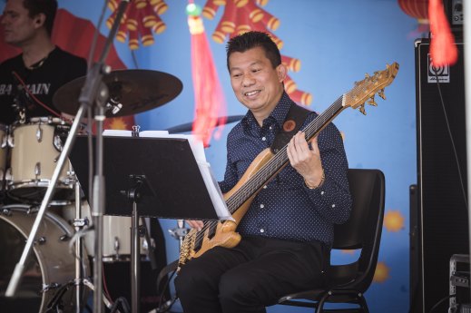 Trung Truong, a local businessman, played bass for hours at the St Albans Lunar New Year Festival. 