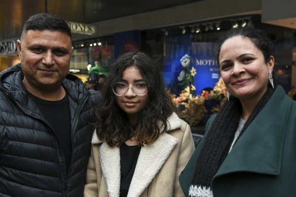 Amarjeet Sharma, right, of Mount Waverley, in Bourke Street Mall with husband, Vishal Sharma, and daughter Kheyaira. 