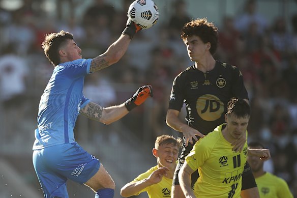 Phoenix goalkeeper Oliver Sail punches the ball to safety during Sunday’s 2-2 A-League draw with Western Sydney.