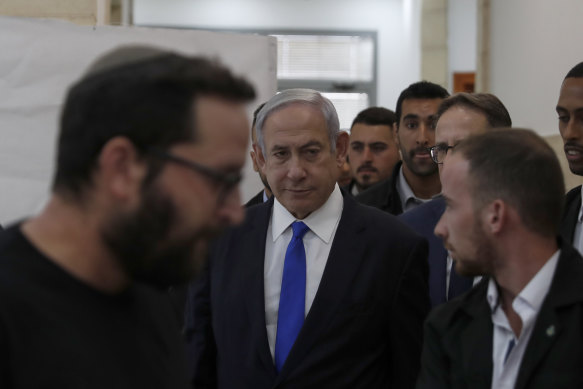 Israeli Prime Minister Benjamin Netanyahu arrives at the District Court in Jerusalem to hear the evidence.