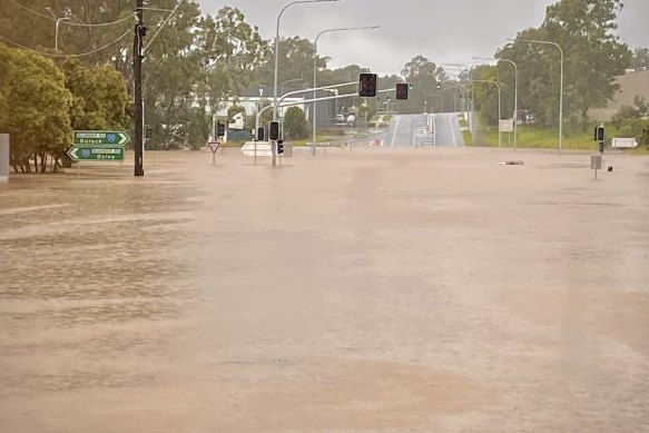 The Boundary and Blunder roads intersection at Oxley in Brisbane was under deep water on Saturday.