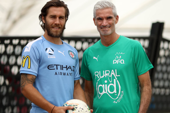 Melbourne City's Josh Brillante poses with former Socceroo Craig Foster, who will be taking part in the charity curtain-raiser.