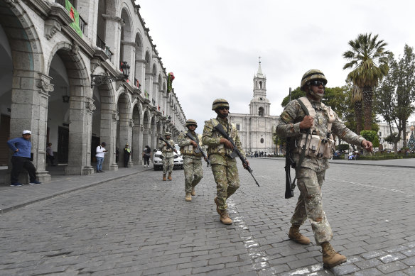 Soldiers patrol in Arequipa, Peru, after the government declared a 30-day national emergency.
