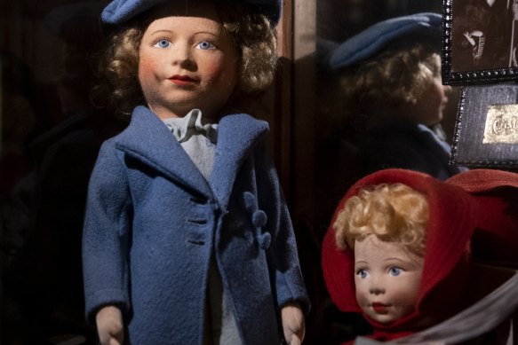 Princess Elizabeth (blue coat) and sister Princess Margaret.