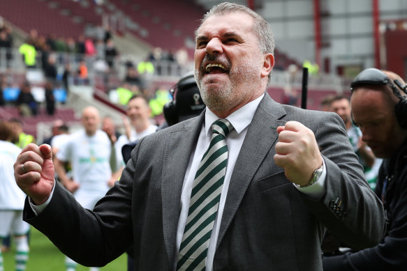 Ange Postecoglou celebrates after winning the Scottish Premiership.