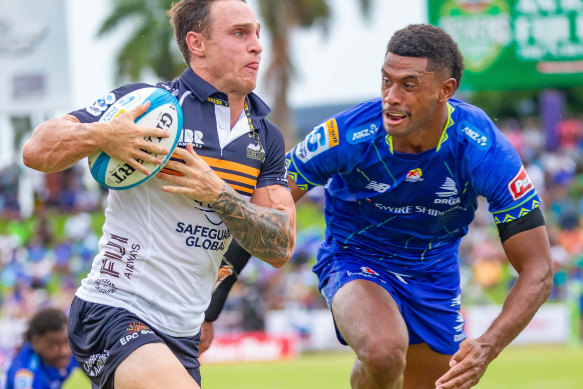 Corey Toole of the Brumbies runs with the ball in Suva.