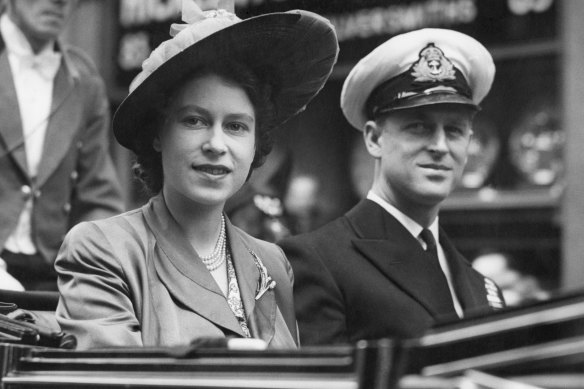 Licence to rule: Elizabeth rides with Prince Philip in London in 1948.