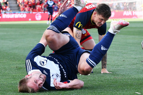 Victory’s Callum McManaman is brought to ground.