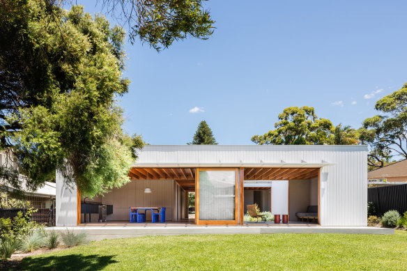 The living and dining quarters open to a generous garden.