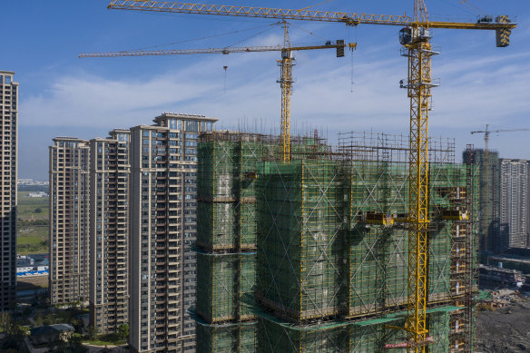 Borrowers for incomplete apartment developments in China are refusing to make payments on their debts, exacerbating the existing crisis within China’s vital property sector.