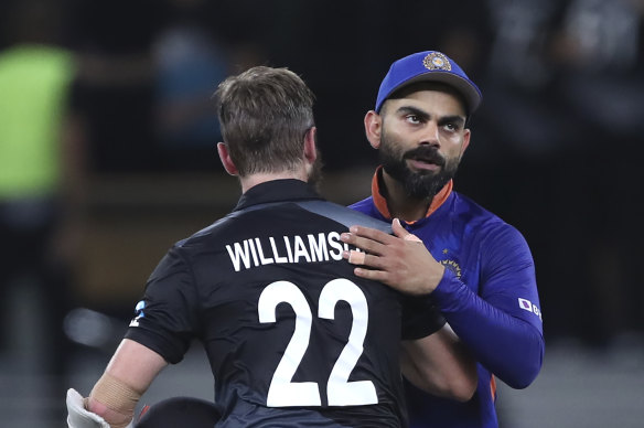 A dejected Virat Kohli congratulates New Zealand counterpart Kane Williamson after tournament favourites India slumped to a second straight T20 World Cup defeat.