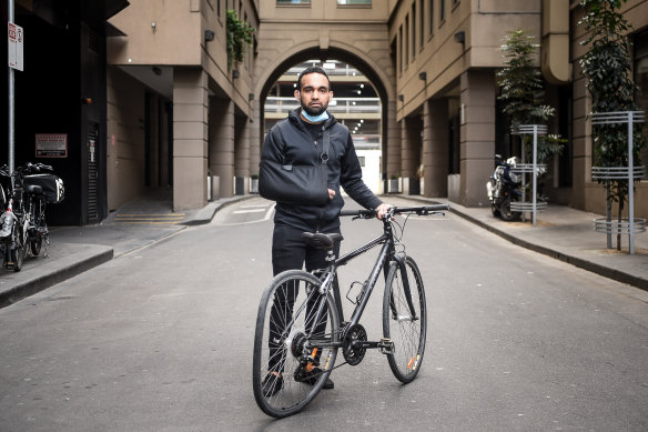 Korey Penny pictured in 2020 with his damaged bike.