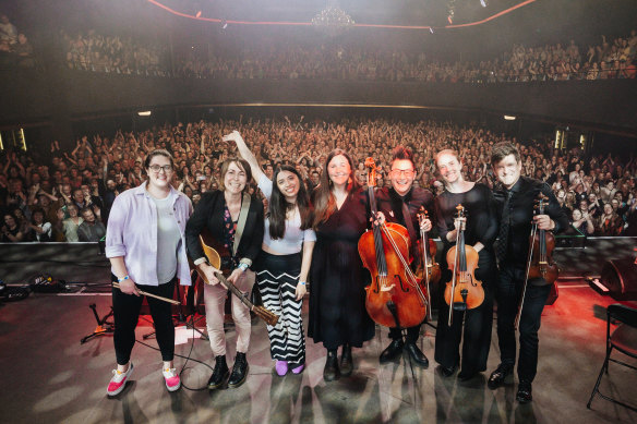 Astrid Jorgensen (arm raised) at Brisbane’s Fortitude Music Hall after leading a Pub Choir performance of Running Up That Hill.