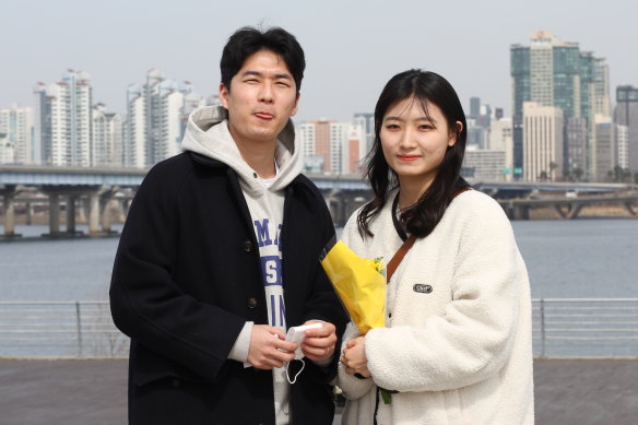 Kang Dong-hwan, 25, a business information systems graduate, with his girlfriend Ji Su-hyeon, 21 in Seoul.