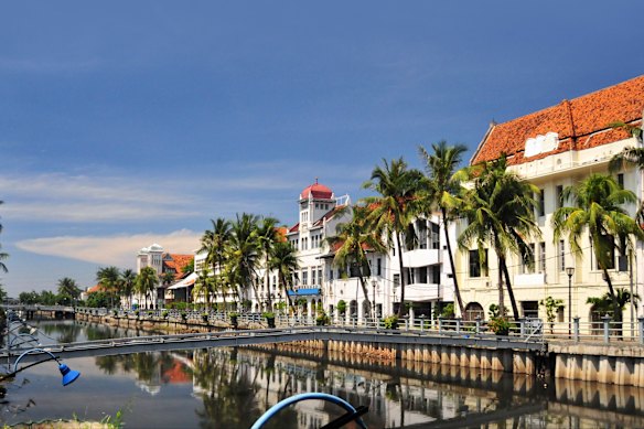 Historic Dutch colonial buildings line the Kali Besar Canal in picturesque Old Jakarta.