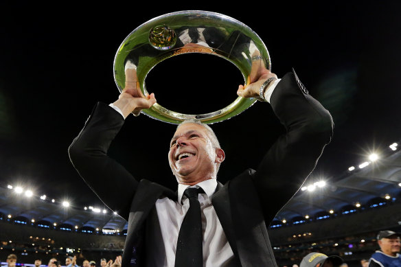 Sydney FC coach Steve Corica with the trophy after winning last season's A-League grand final.