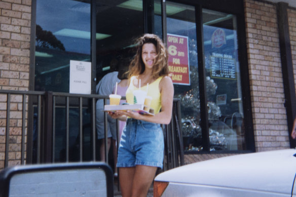 Dina, aged 16, in a fluoro one-piece and denim shorts.