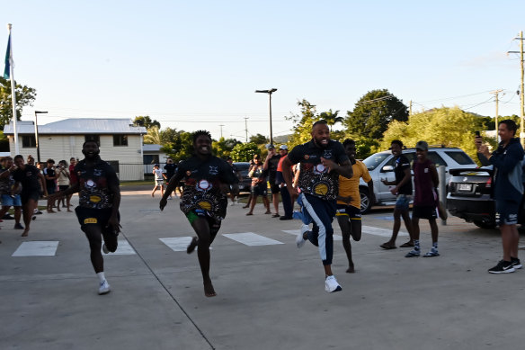 Josh Addo-Carr races a few kids living at Cowboys House.