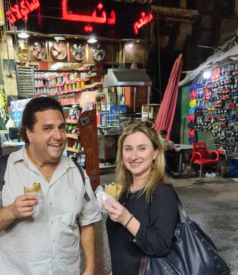 Bellies En Route guide Amir Bishara with the author on their food tour.
