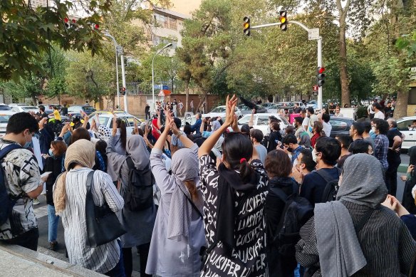 People gather in protest against the death of Mahsa Amini along the streets in Tehran, Iran.
