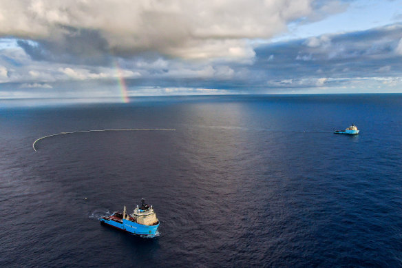 Ocean Cleanup vessels trawl the ocean for plastic using a net during a trial in October 2021.