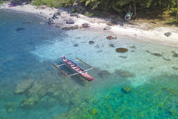 A canoe on the water off Atauro – the island is one of the best scuba sites in the world.