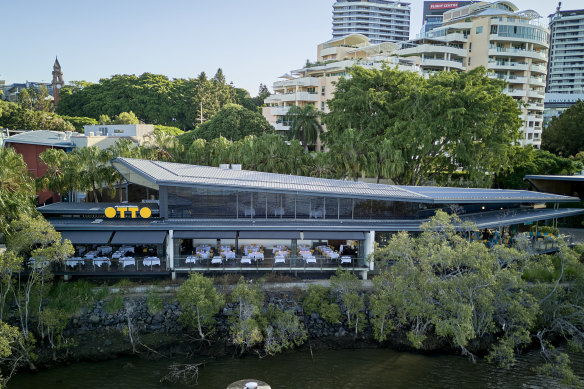 Otto sits on river at South Bank.