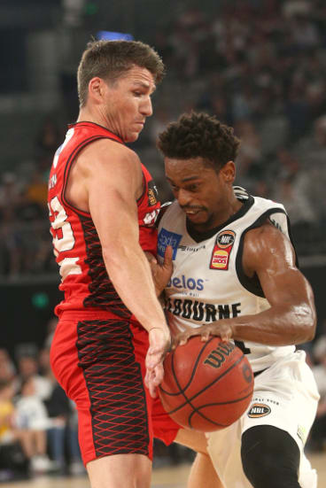 Casper Ware of Melbourne, right, battles Damian Martin of Perth.