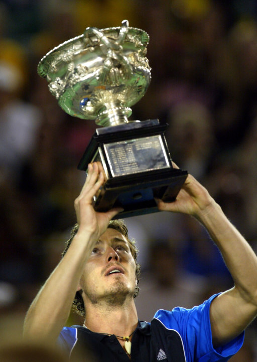 Marat Safin holds up the trophy.