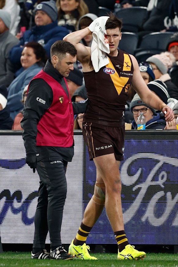 Heavy knock: Mitch Lewis leaves the field.