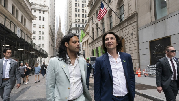 Baiju Bhatt, left, and Vladimir Tenev, co-founders of Robinhood, walking on Wall Street after their company’s IPO on July 29.