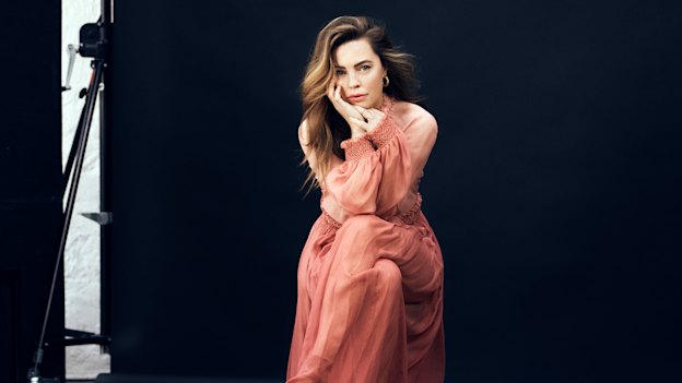 Melissa wears dress and sandals
by Christian Dior, earrings by
Bonanza Paris, rings by Mansano.