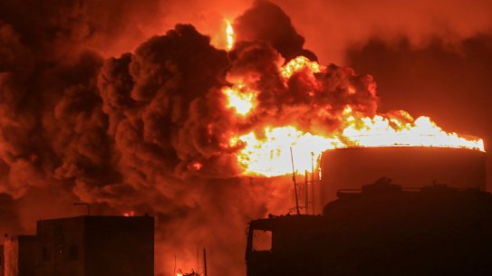 Oil tanks burn at the port in Hodeidah, Yemen on Sunday.