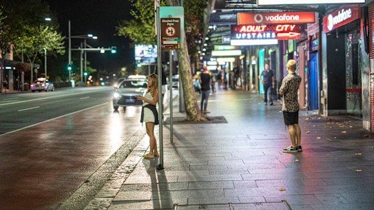 Punters spill out down an empty Oxford Street.