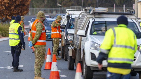 Australian Army soldiers assist police at the NSW-Victoria border control point in Albury.