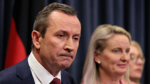 Mark McGowan was flanked by his wife, Sarah, and most of the state’s cabinet at the press conference.
