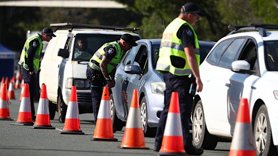Police stop vehicles at the Queensland-NSW border in Coolangatta on Sunday, October 1. 