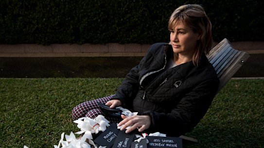 Jane Malcolm with names of all the MH17 victims, including her mum, and step-dad, Carol and Michael Clancy, which will be hung outside of the Russioan Consulate in Sydney.
