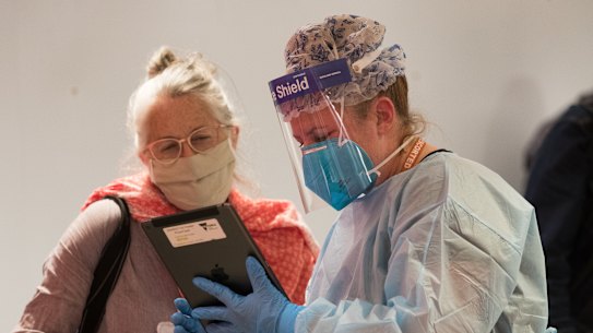 Interstate travellers are screened at Melbourne Airport. 