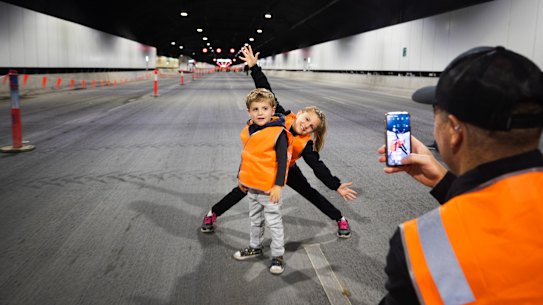 Gymea resident Dave Spears photographs son Thomas and daughter Skylah in the M4-M8 Link tunnels on Sunday.