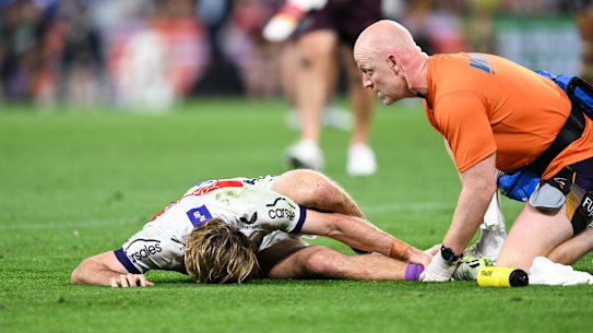 Ryan Papenhuyzen clutches at his broken ankle on Friday night.